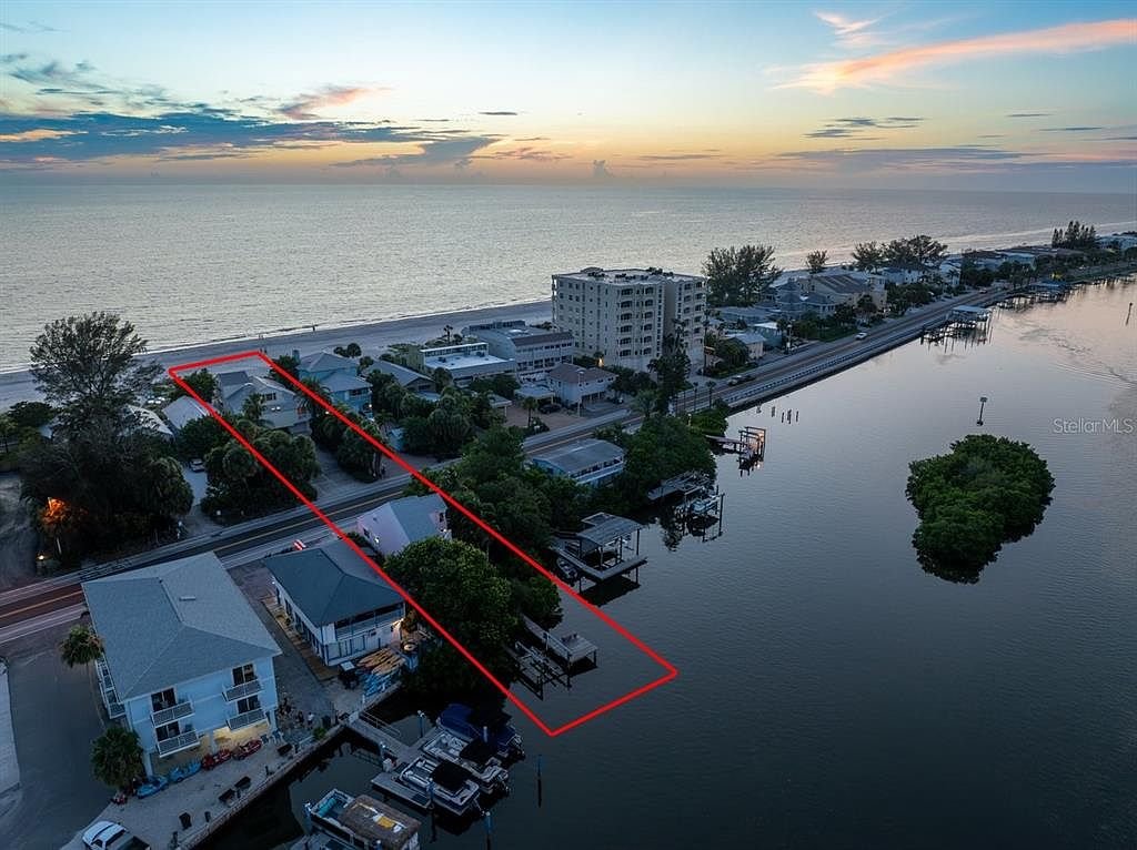 Beach-to-bay compound with two homes